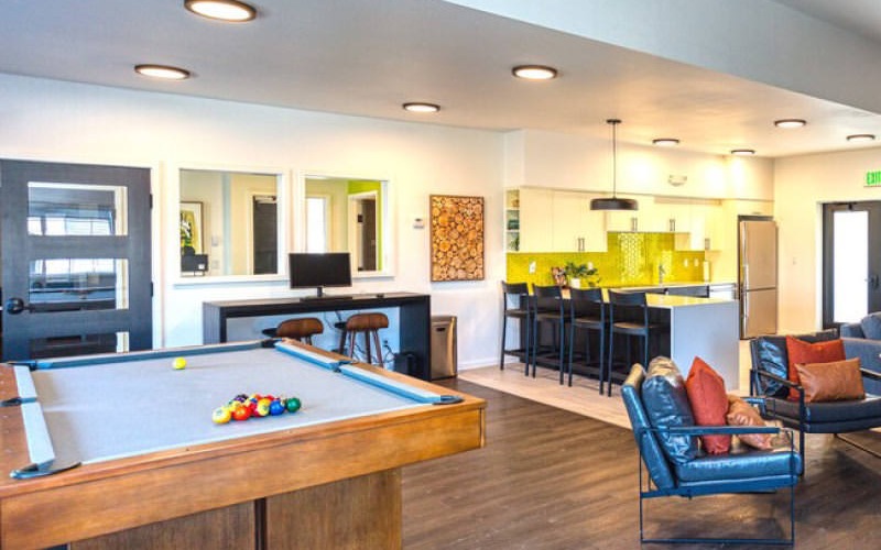 bright clubhouse with billiards table